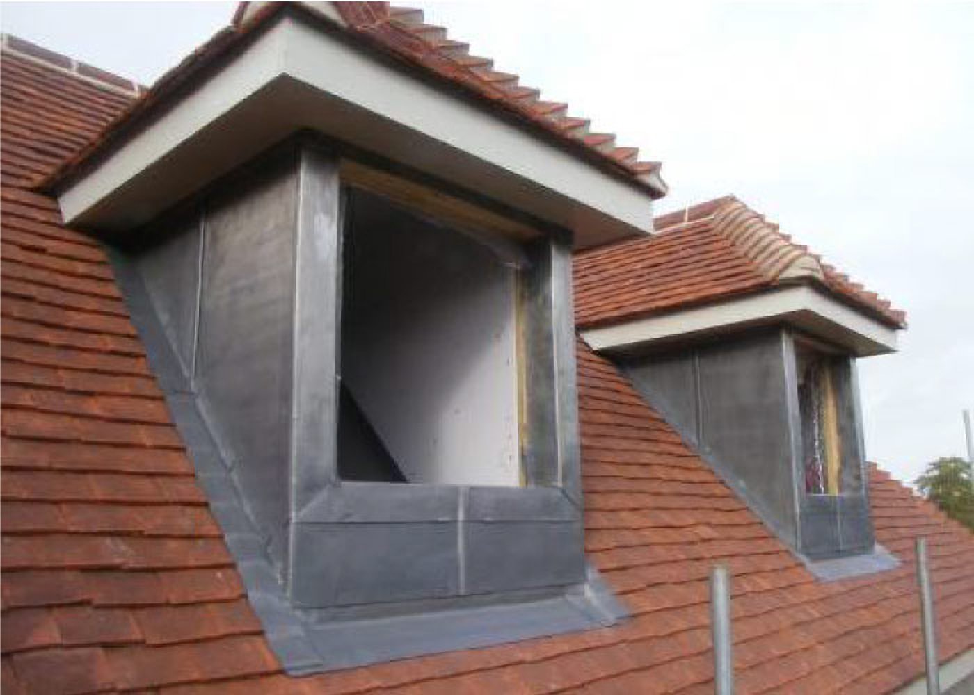 Completed double-storey wrap-around brick extension on a Manchester semi-detached home